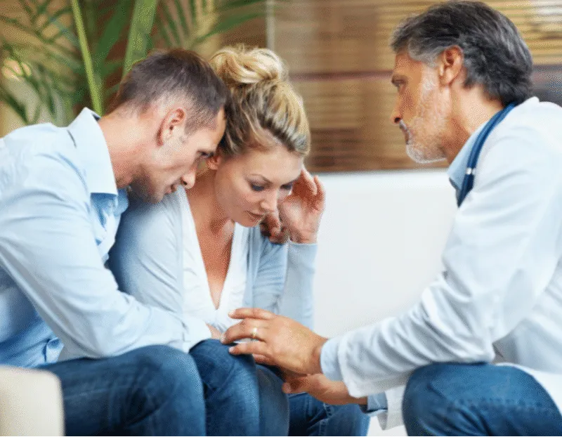 Couple hearing bad news from doctor